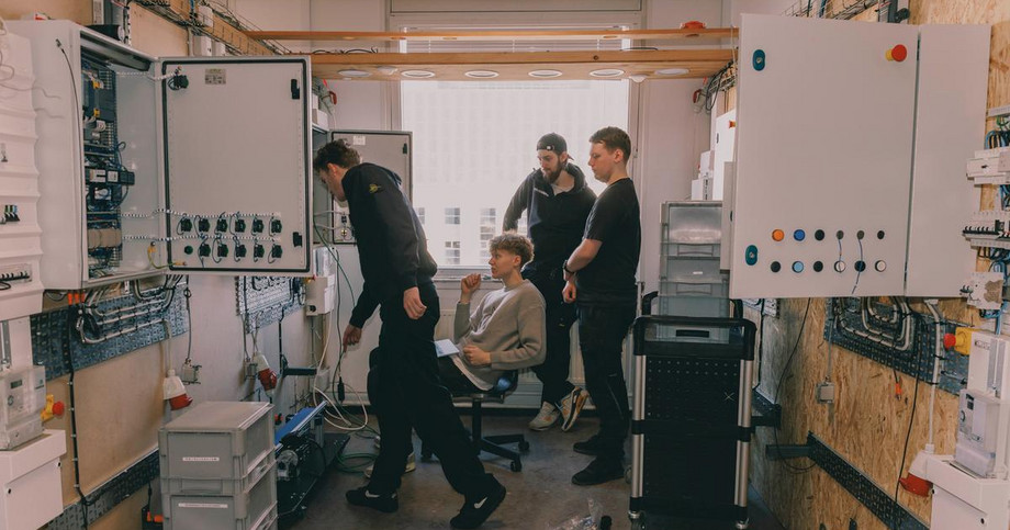 Three men working
