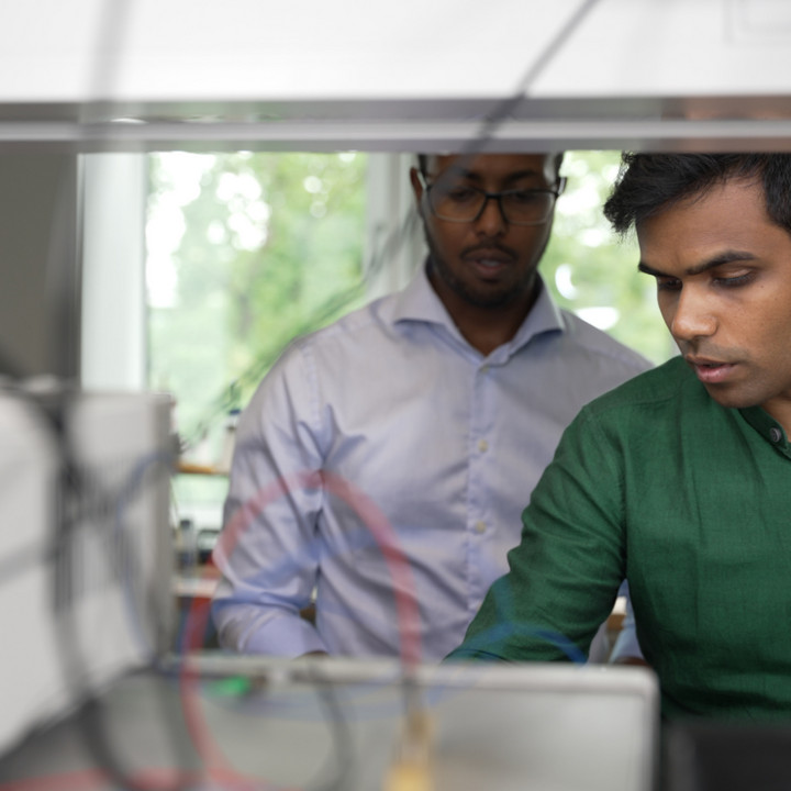 Men looking at a PC